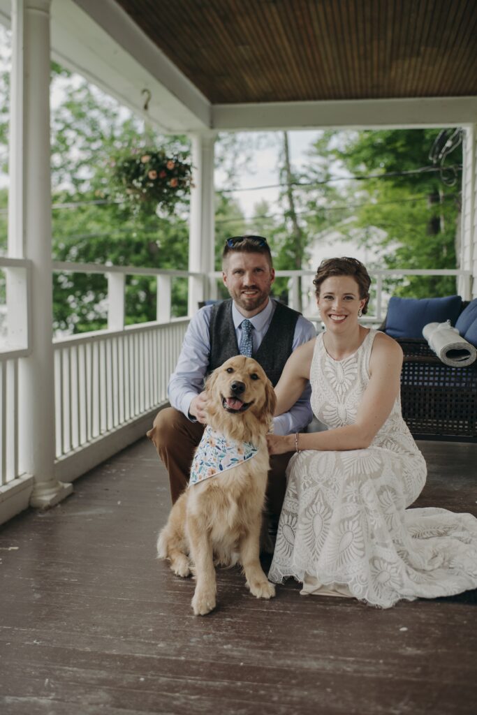 wedding couple with dog at the at the lake bomoseen lodge