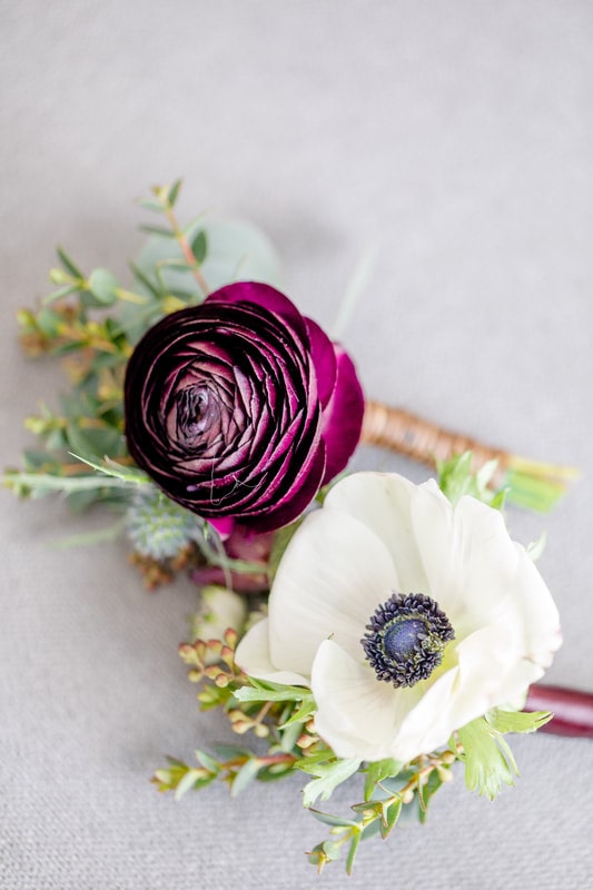 ranunculus and anemone boutonniere