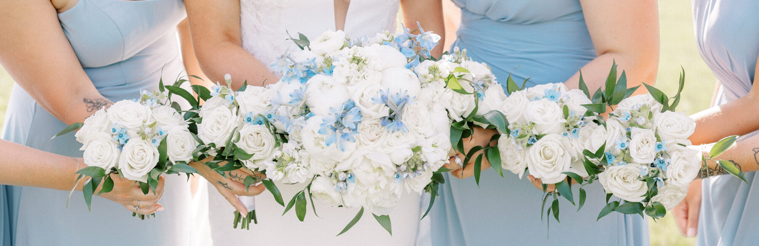 White and Blue Bridal Bouquet with white and blue bridesmaid bouquets