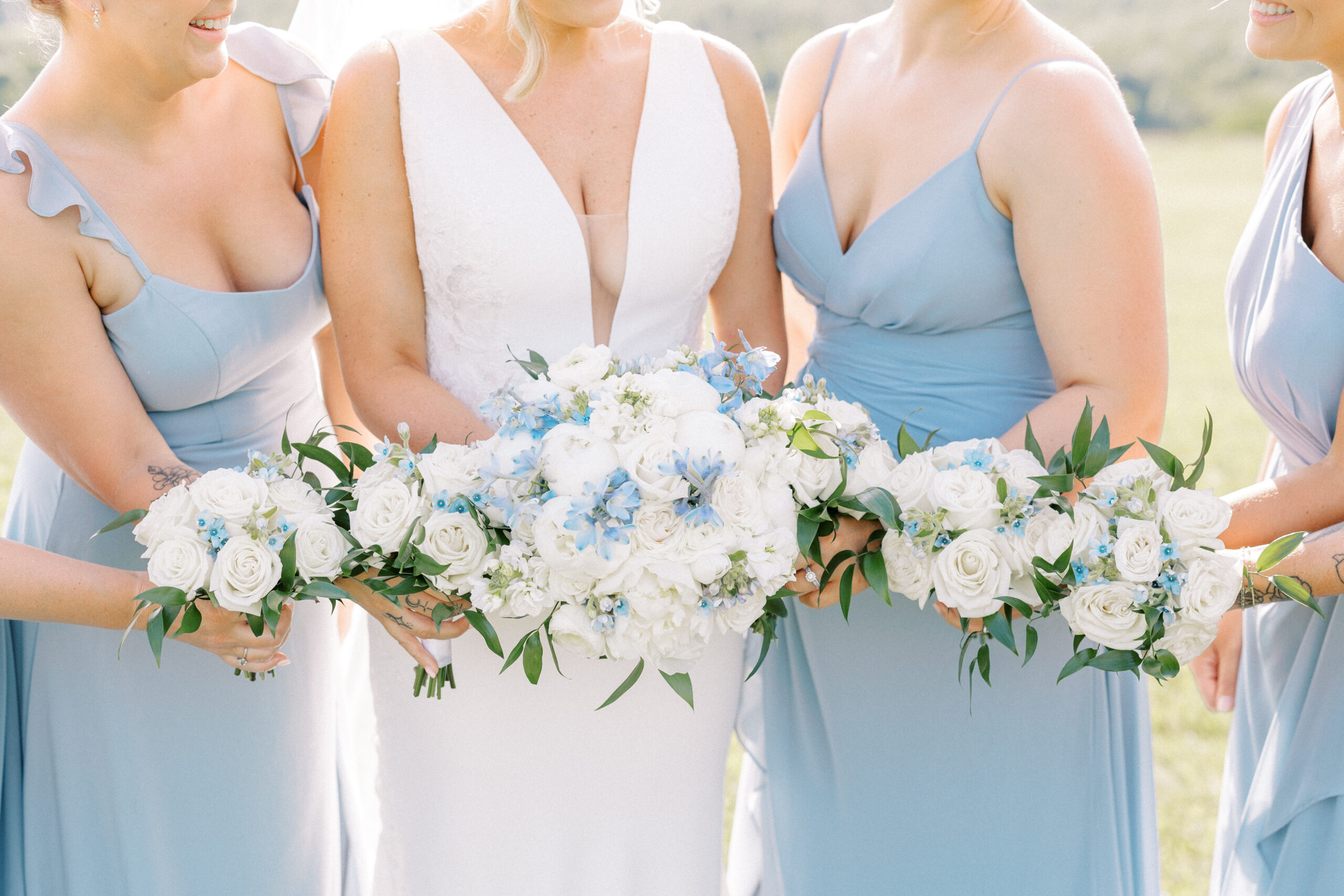 White and Blue Bridal Bouquet with white and blue bridesmaid bouquets