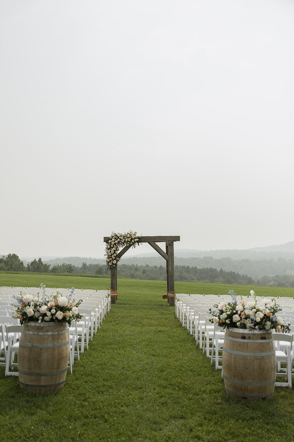 Ground arch and barrels decorated with lush butter yellow and pastel florals. 