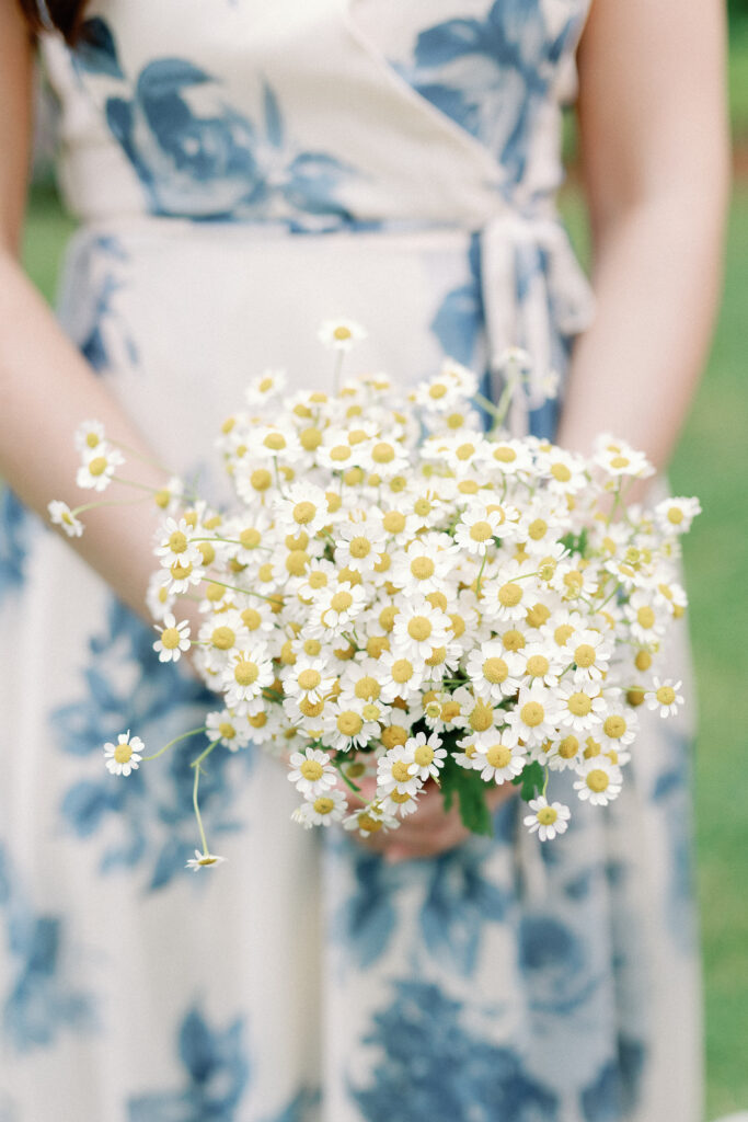 Close up of a feverfew monobloom bridesmaid bouquet