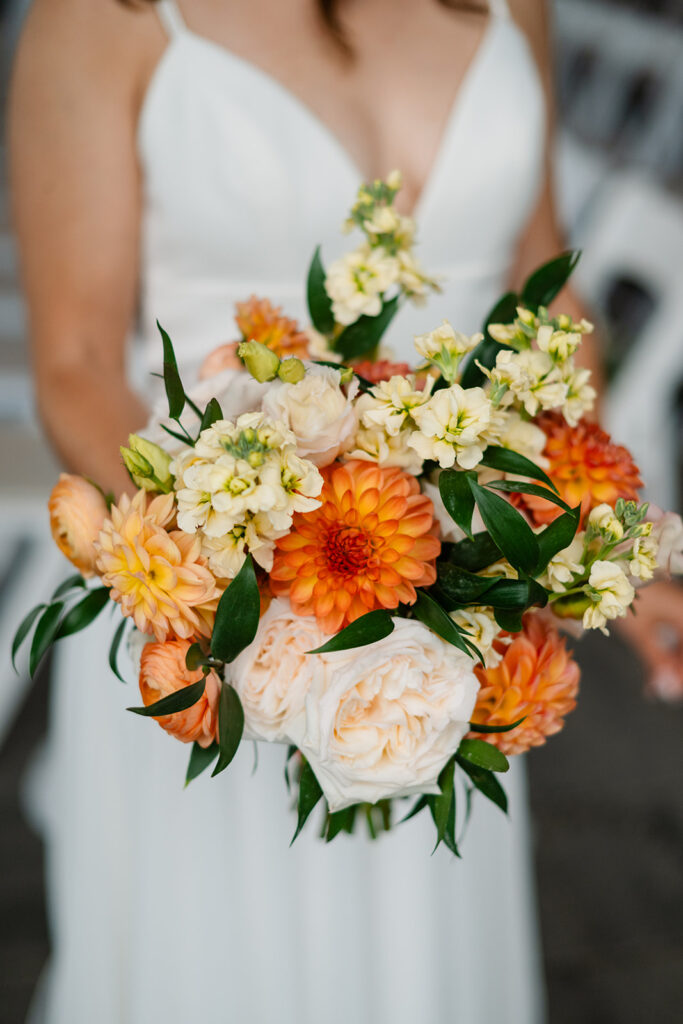 Orange, blush and yellow bridal bouquet. 